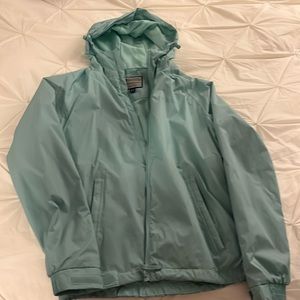 Mountain Warehouse Rainjacket/Windbreaker Size 6. Light Blue. In new condition.